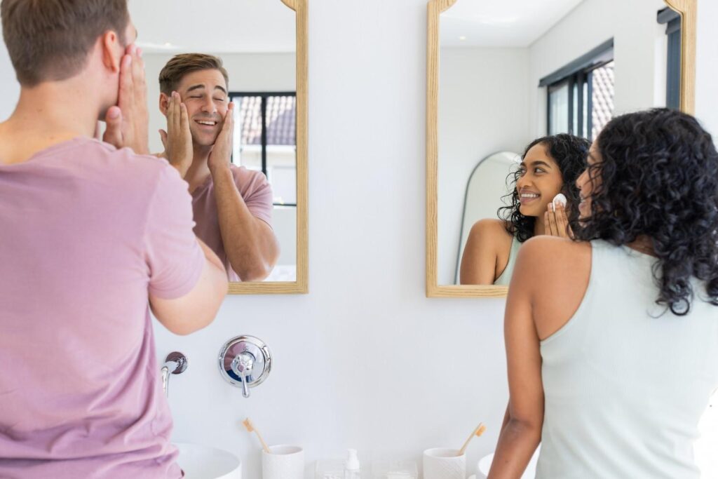 woman and man looking at mirror