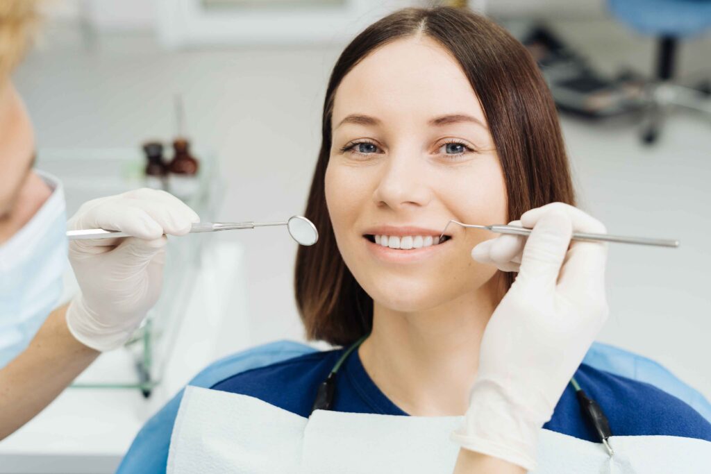 Dentist treating a patient in a dental clinic.